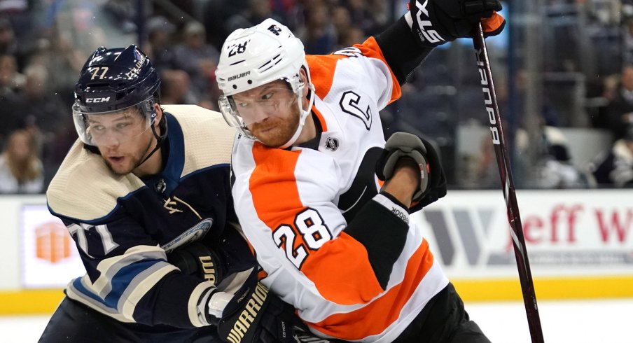 Oct 18, 2018; Columbus, OH, USA; Columbus Blue Jackets right wing Josh Anderson (77) skates against Philadelphia Flyers center Claude Giroux (28) at Nationwide Arena.