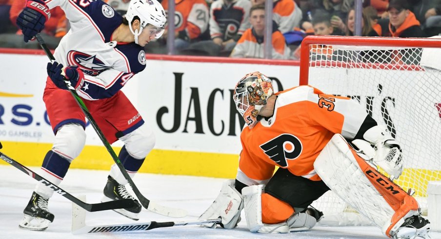  Philadelphia Flyers goaltender Brian Elliott (37) makes a save as Columbus Blue Jackets center Alexandre Texier (42) reaches for rebound during the first period at Wells Fargo Center.