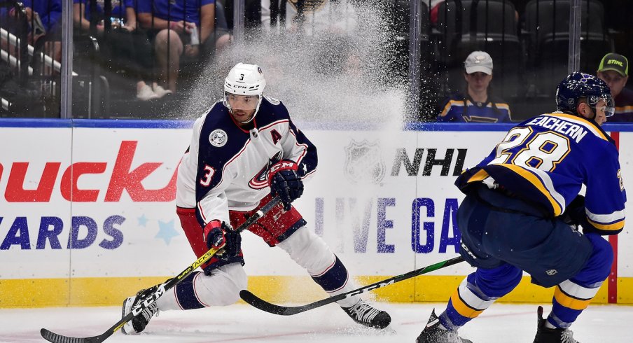 Columbus Blue Jackets defenseman Seth Jones (3) handles the puck as St. Louis Blues left wing Mackenzie MacEachern (28) defends during the second period at Enterprise Center.