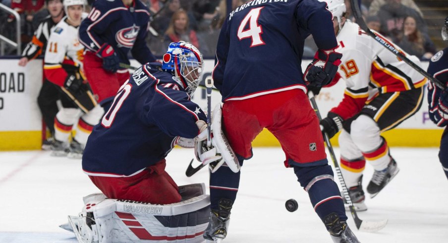 Nov 2, 2019; Columbus, OH, USA; Columbus Blue Jackets goaltender Joonas Korpisalo (70) deflects a shot during the game against the Calgary Flames at Nationwide Arena.