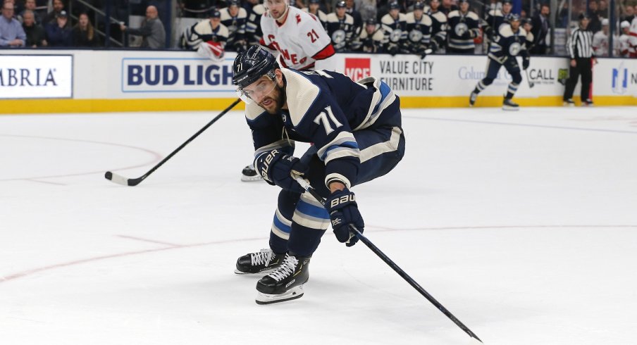  Nick Foligno fights for a puck