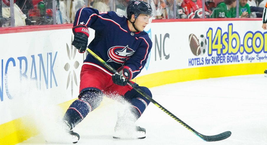 Oct 12, 2019; Raleigh, NC, USA; Columbus Blue Jackets defenseman Zach Werenski (8) stops with the puck against the Carolina Hurricanes at PNC Arena. The Columbus Blue Jackets defeated the Carolina Hurricanes 3-2. Mandatory Credit: James Guillory-USA TODAY Sports