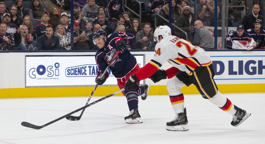 Cam Atkinson shoots during a power play against the Calgary Flames