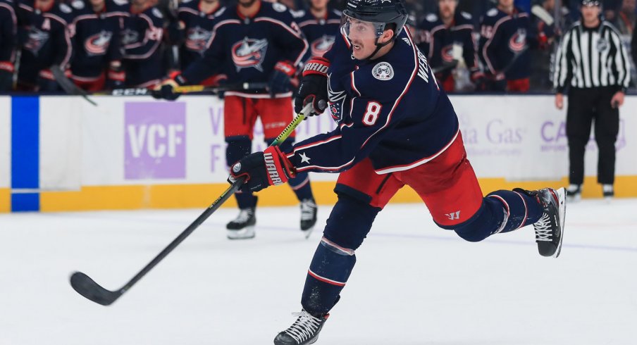 Nov 15, 2019; Columbus, OH, USA; Columbus Blue Jackets defenseman Zach Werenski (8) takes a shot on goal against the St. Louis Blues in the overtime period at Nationwide Arena. Mandatory Credit: Aaron Doster-USA TODAY Sports