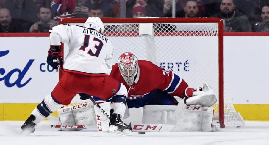 Nov 12, 2019; Montreal, Quebec, CAN; Columbus Blue Jackets forward Cam Atkinson (13) can not score against Montreal Canadiens goalie Carey Price (31) during the shootout period at the Bell Centre. Mandatory Credit: Eric Bolte-USA TODAY Sports