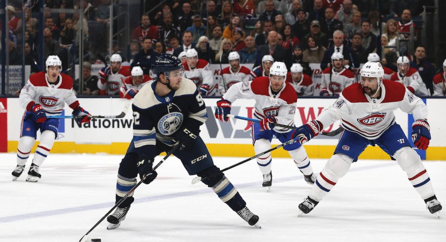 Columbus Blue Jackets center Emil Bemstrom (52) looks to pass as Montreal Canadiens center Nate Thompson (44) defends during the first period at Nationwide Arena.