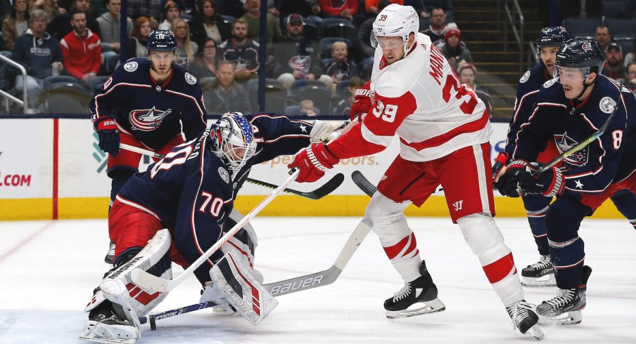 Columbus Blue Jackets goalie Joonas Korpisalo (70) makes a stick save against the Detroit Red Wings during the first period at Nationwide Arena.