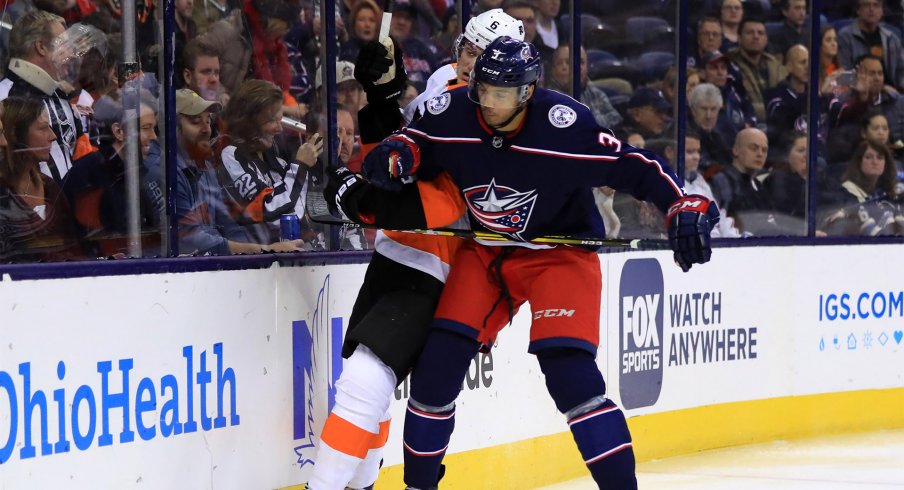 Feb 28, 2019; Columbus, OH, USA; Columbus Blue Jackets defenseman Seth Jones (3) checks Philadelphia Flyers defenseman Travis Sanheim (6) along the boards in the first period at Nationwide Arena.