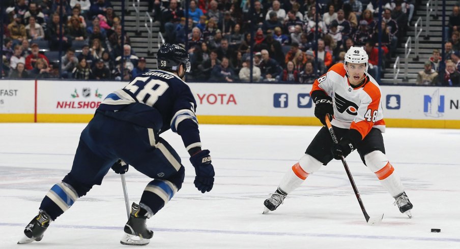 Nov 27, 2019; Columbus, OH, USA; Philadelphia Flyers center Morgan Frost (48) passes the puck against the Columbus Blue Jackets during the first period at Nationwide Arena.