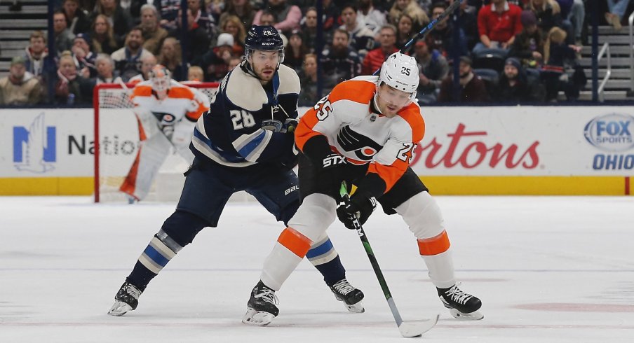 Nov 27, 2019; Columbus, OH, USA; Philadelphia Flyers left wing James van Riemsdyk (25) skates with the puck as\Columbus Blue Jackets right wing Oliver Bjorkstrand (28) trails the play during the first period at Nationwide Arena.