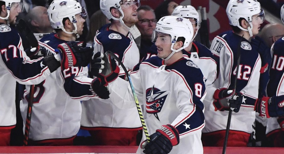 Columbus Blue Jackets defenseman Zach Werenski (8) reacts with teammates after scoring a goal against the Montreal Canadiens during the third period at the Bell Centre.