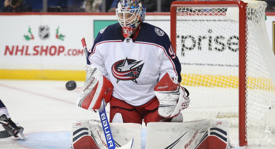 Nov 30, 2019; Brooklyn, NY, USA; Columbus Blue Jackets goalie Elvis Merzlikins (90) defends a shot against the New York Islanders during the second period at Barclays Center. Mandatory Credit: Brad Penner-USA TODAY Sports