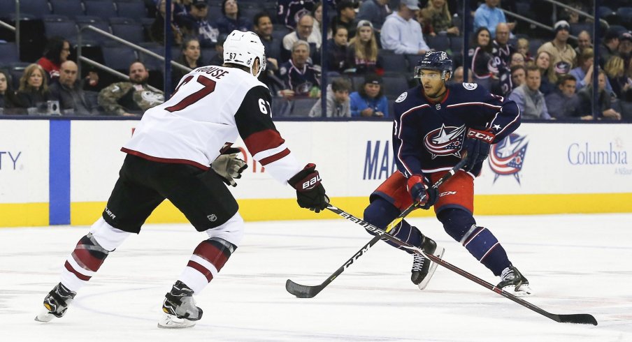 Oct 23, 2018; Columbus, OH, USA; Columbus Blue Jackets defenseman Seth Jones (3) carries the puck as Arizona Coyotes left wing Lawson Crouse (67) defends during the first period at Nationwide Arena.