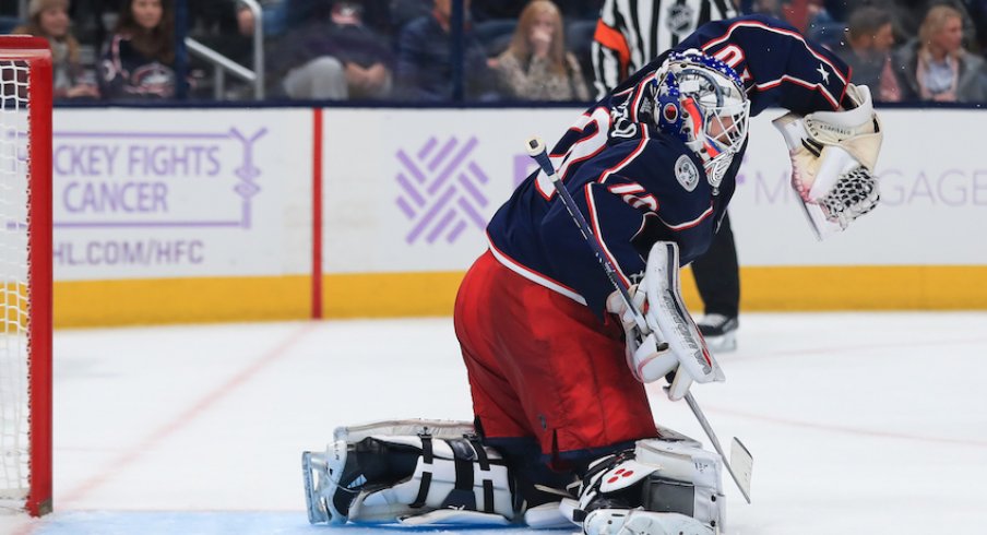 Columbus Blue Jackets goaltender Joonas Korpisalo (70) makes a glove save in net against the St. Louis Blues in the third period at Nationwide Arena.