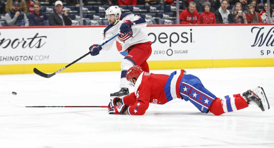 Dec 9, 2019; Washington, DC, USA; Columbus Blue Jackets right wing Oliver Bjorkstrand (28) shoots the puck as Washington Capitals defenseman Michal Kempny (6) defends in the first period at Capital One Arena. Mandatory Credit: Geoff Burke-USA TODAY Sports