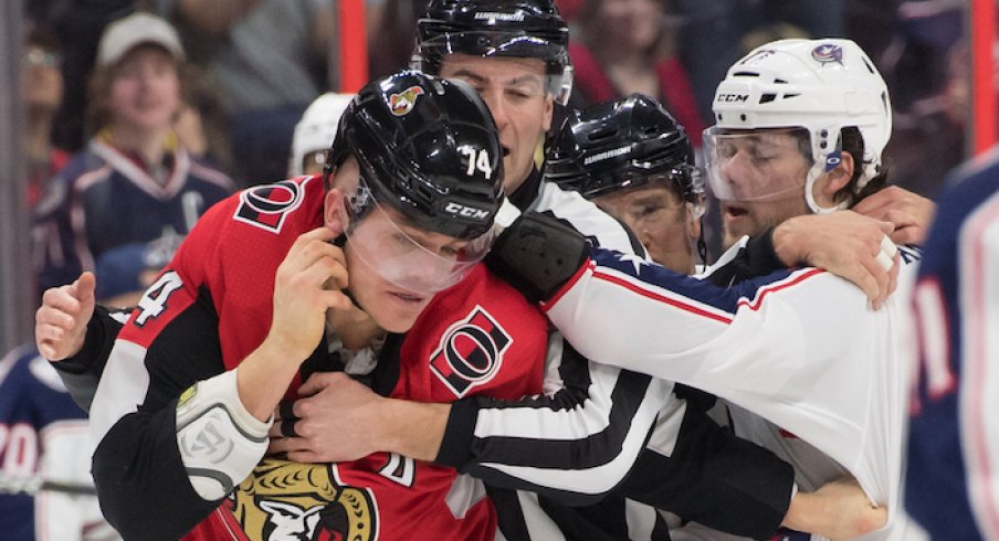 Ottawa Senators defenseman Mark Borowiecki (74) fights with Columbus Blue Jacketsv right wing Josh Anderson (77) in the first period at the Canadian Tire Centre.