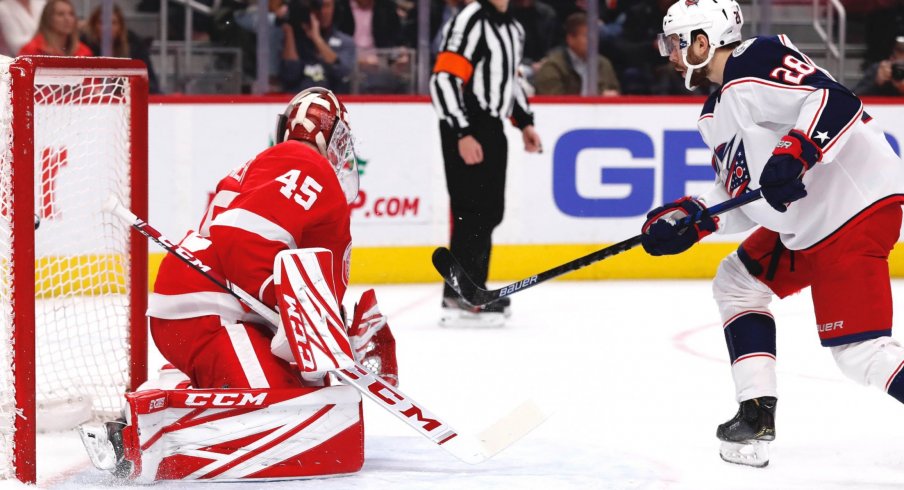 Dec 17, 2019; Detroit, MI, USA; Columbus Blue Jackets right wing Oliver Bjorkstrand (28) scores on Detroit Red Wings goaltender Jonathan Bernier (45) in the first period at Little Caesars Arena.