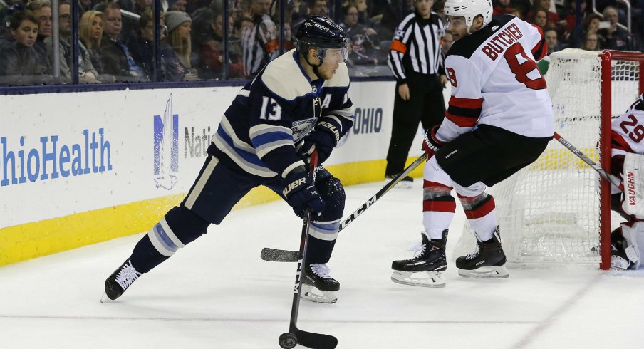 Dec 20, 2018; Columbus, OH, USA; Columbus Blue Jackets right wing Cam Atkinson (13) grabs a loose puck during the second period against the New Jersey Devils at Nationwide Arena.