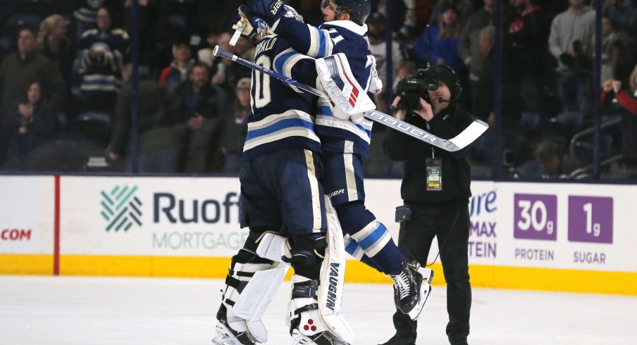 Dec 19, 2019; Columbus, OH, USA; Columbus Blue Jackets goalie Joonas Korpisalo (70) and left wing Nick Foligno (71) celebrate after defeating the Los Angeles Kings at Nationwide Arena.