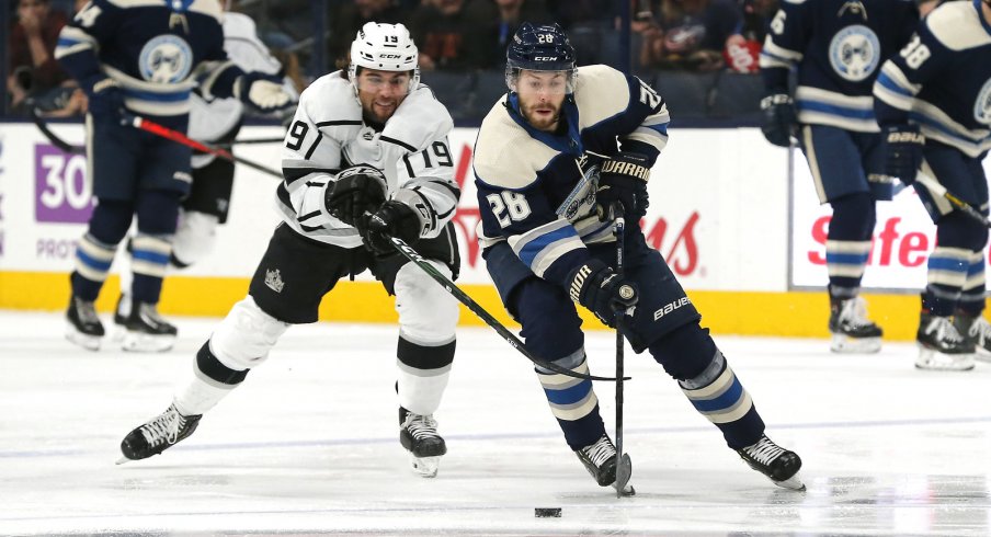 Dec 19, 2019; Columbus, OH, USA; Columbus Blue Jackets right wing Oliver Bjorkstrand (28) skates with the puck as Los Angeles Kings left wing Alex Iafallo (19) defends during the first period at Nationwide Arena. Mandatory Credit: Russell LaBounty-USA TODAY Sports