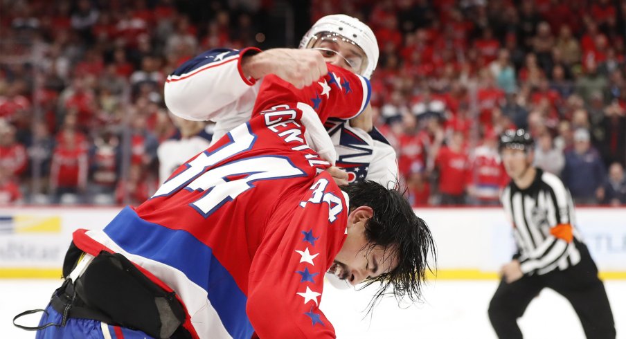 Dec 27, 2019; Washington, District of Columbia, USA; Columbus Blue Jackets left wing Nick Foligno (71) fights Washington Capitals defenseman Jonas Siegenthaler (34) in the second period at Capital One Arena.