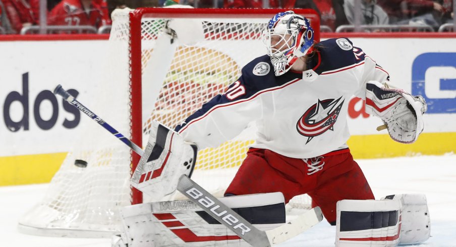 Dec 27, 2019; Washington, District of Columbia, USA; Columbus Blue Jackets goaltender Joonas Korpisalo (70) makes a save against the Washington Capitals in the first period at Capital One Arena. Mandatory Credit: Geoff Burke-USA TODAY Sports