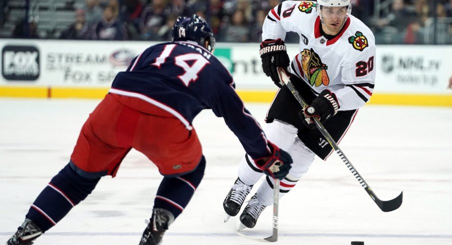 Chicago Blackhawks left wing Brandon Saad (20) skates against Columbus Blue Jackets defenseman Dean Kukan (14) in the third period at Nationwide Arena.