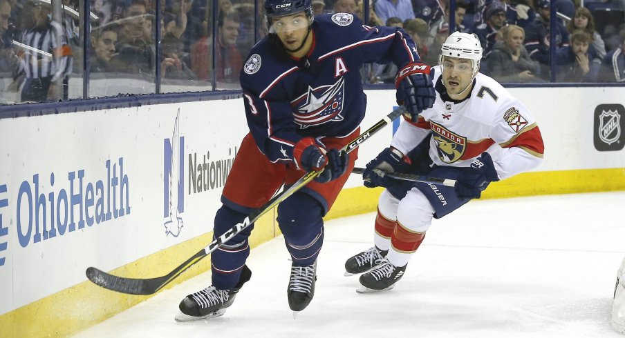 Mar 22, 2018; Columbus, OH, USA; Columbus Blue Jackets defenseman Seth Jones (3) and Florida Panthers center Colton Sceviour (7) chase after a loose puck during the third period at Nationwide Arena.
