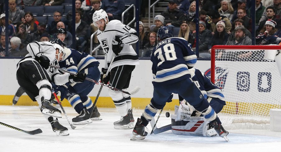 onas Korpisalo makes a save against the Los Angeles Kings