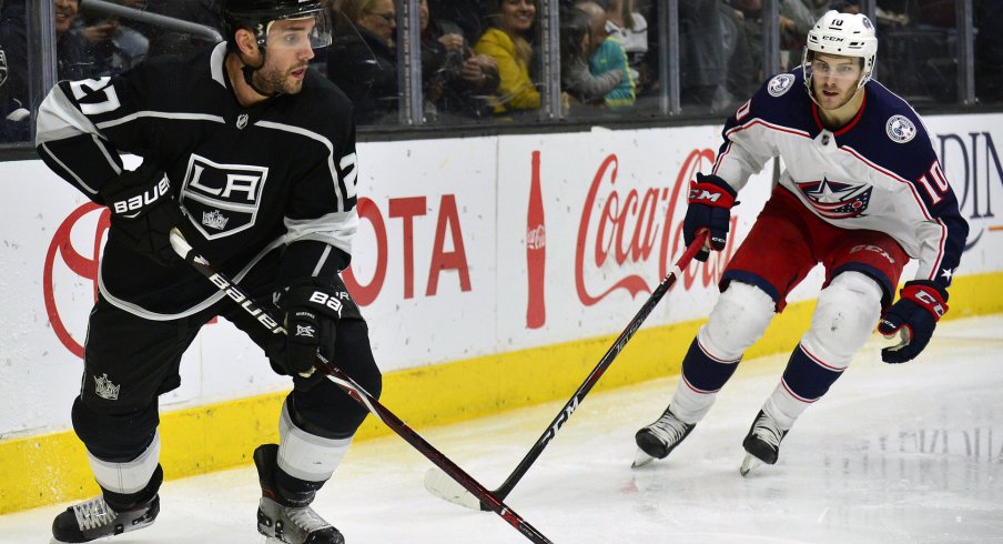 March 1, 2018; Los Angeles, CA, USA; Los Angeles Kings defenseman Alec Martinez (27) moves the puck against Columbus Blue Jackets center Alexander Wennberg (10) during the third at Staples Center. Mandatory Credit: Gary A. Vasquez-USA TODAY Sports