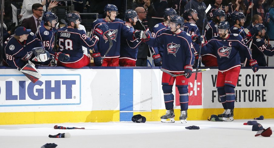 Zach Werenski celebrates his first career hat trick