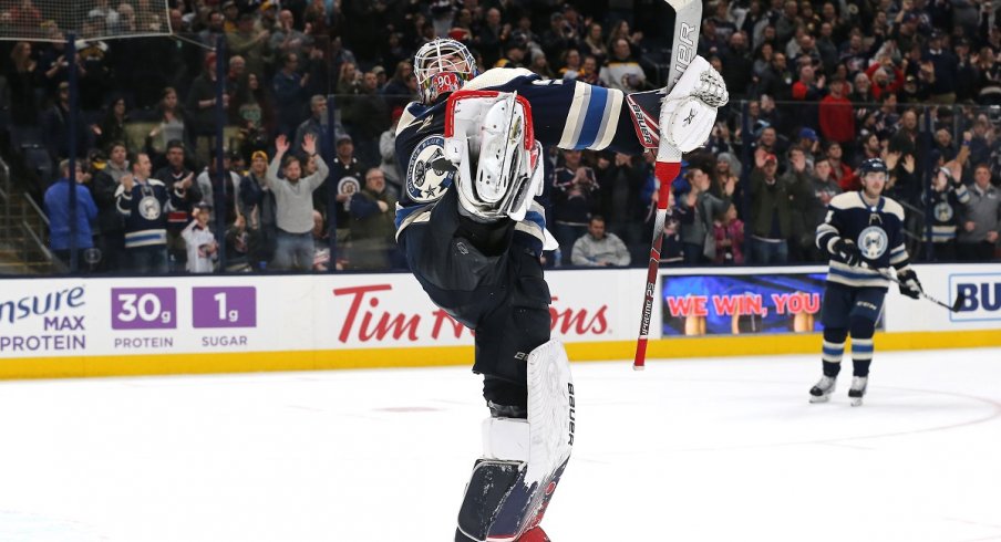  Elvis Merzlikins celebrates his first career home shutout at Nationwide Arena