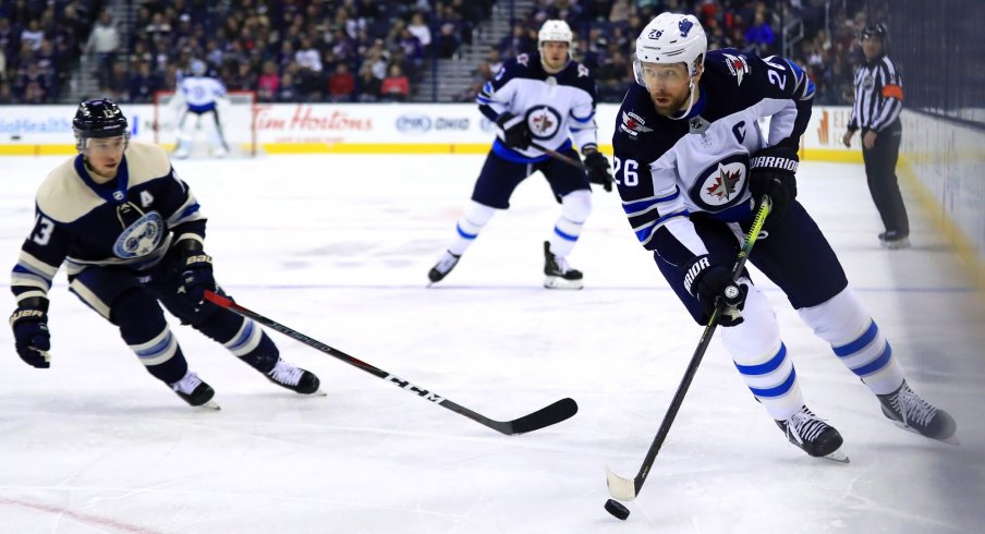 Mar 3, 2019; Columbus, OH, USA; Winnipeg Jets right wing Blake Wheeler (26) skates with the puck against the Columbus Blue Jackets in the first period at Nationwide Arena.