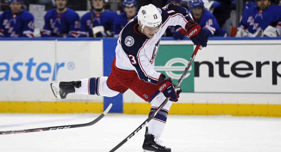 Jan 19, 2020; New York, New York, USA; Columbus Blue Jackets right wing Cam Atkinson (13) takes a shot during the first period against the New York Rangers at Madison Square Garden.