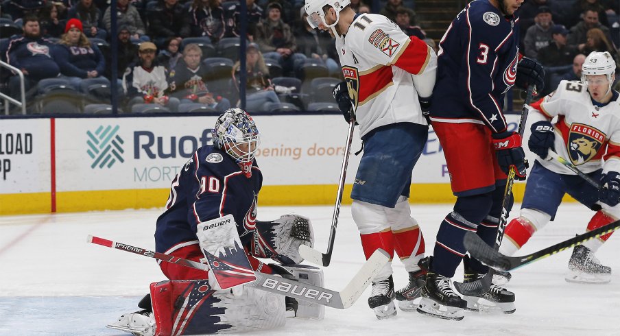 Columbus Blue Jackets goalie Elvis Merzlikins (90) makes a pad save as Florida Panthers left wing Jonathan Huberdeau (11) looks for a rebound during the first period at Nationwide Arena.