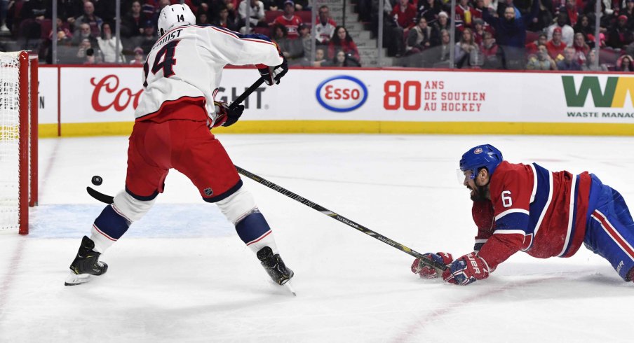 Feb 2, 2020; Montreal, Quebec, CAN; Columbus Blue Jackets forward Gustav Nyquist (14) scores a goal and Montreal Canadiens defenseman Shea Weber (6) defends during the third period at the Bell Centre.