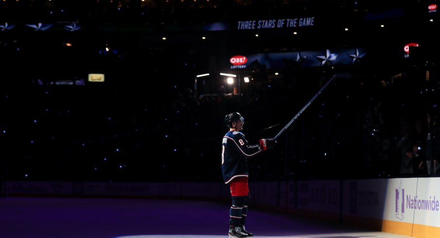 Columbus Blue Jackets defenseman Zach Werenski (8) skates on the ice for being named a star of the game, after scoring the game winning goal against the St. Louis Blues in the overtime period at Nationwide Arena. 