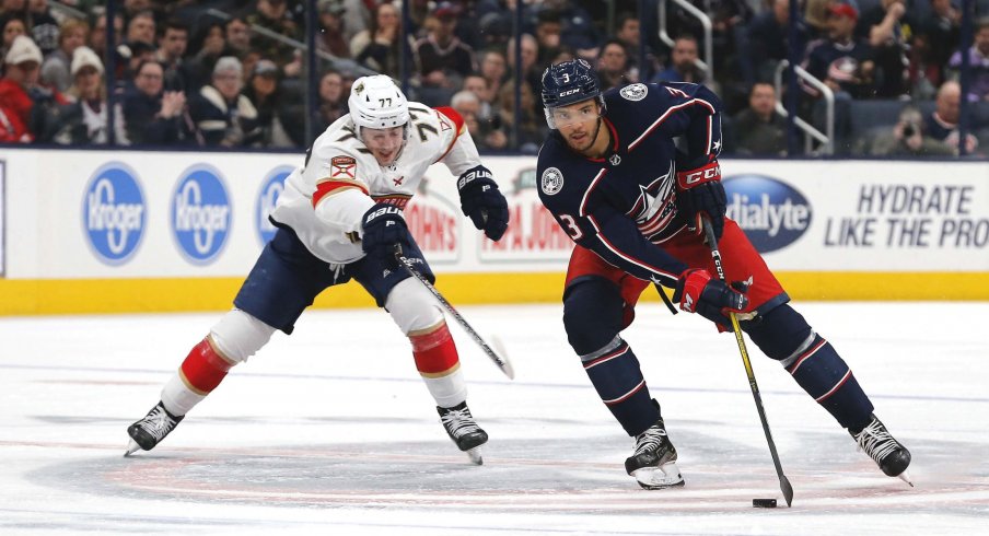 Feb 4, 2020; Columbus, Ohio, USA; Columbus Blue Jackets defenseman Seth Jones (3) stick handles as Florida Panthers left wing Frank Vatrano (77) trails the play during the second period at Nationwide Arena.