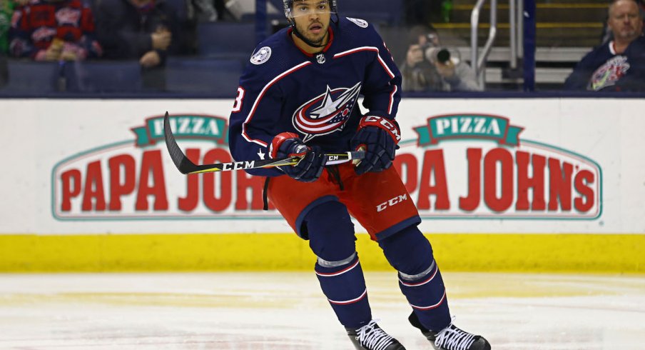 Columbus Blue Jackets defenseman Seth Jones (3) skates up ice with the puck ahead of Pittsburgh Penguins center Sidney Crosby (87) during the first period at PPG PAINTS Arena.