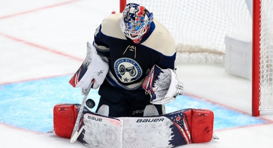 Columbus Blue Jackets goaltender Elvis Merzlikins makes a save against the Tampa Bay Lightning.