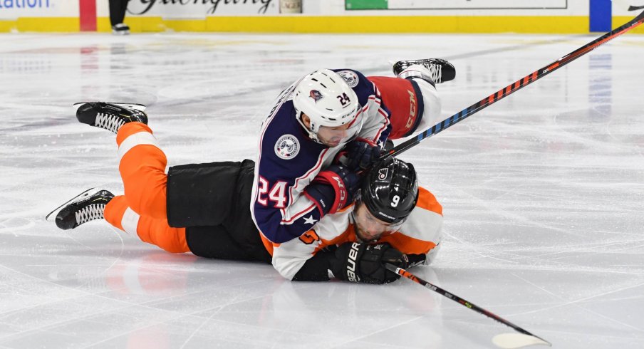 Feb 18, 2020; Philadelphia, Pennsylvania, USA; Philadelphia Flyers defenseman Ivan Provorov (9) and Columbus Blue Jackets center Nathan Gerbe (24) get tangled up during the first period during the first period at Wells Fargo Center.