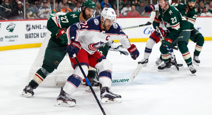 Oct 14, 2017; Saint Paul, MN, USA; Columbus Blue Jackets forward Nick Foligno (71) skates with the puck in the third period against the Minnesota Wild defenseman Kyle Quincey (27) at Xcel Energy Center. Mandatory Credit: Brad Rempel-USA TODAY Sports