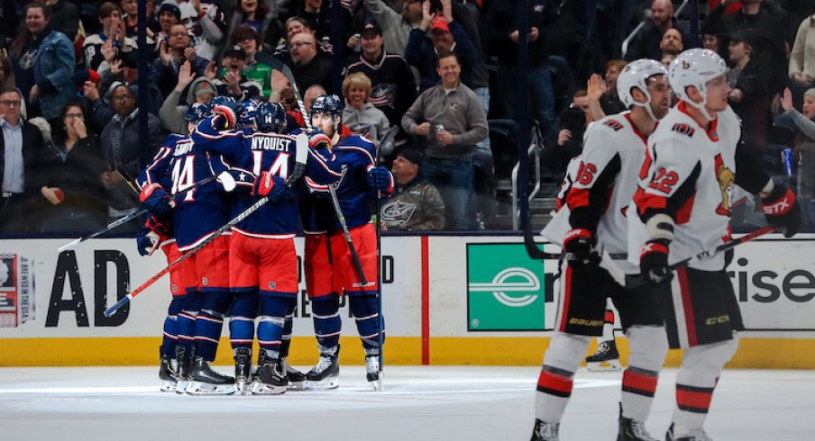 Columbus Blue Jackets left wing Nick Foligno (back) celebrates with teammates after scoring his second goal of the game against the Ottawa Senators in the second period at Nationwide Arena.