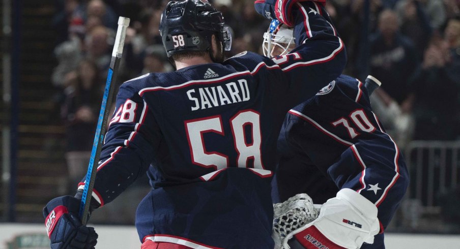 Columbus, Ohio, USA; Columbus Blue Jackets goaltender Joonas Korpisalo (70) is congratulated by center Stefan Matteau (23) after their win against the Vancouver Canucks at Nationwide Arena.