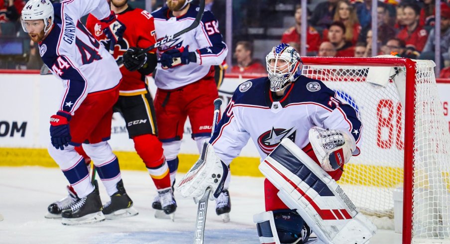 Joonas Korpisalo looks on in 3-2 OTL against Calgary Flames