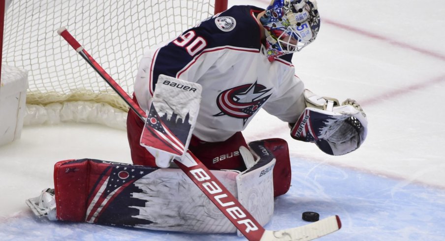 Columbus Blue Jackets goaltender Elvis Merzlikins (90) blocks a shot on net by the Vancouver Canucks during the third period at Rogers Arena.
