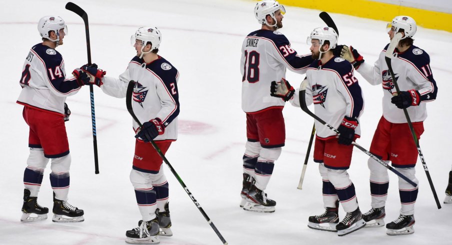 The Columbus Blue Jackets celebrate the win against the Vancouver Canucks during the third period at Rogers Arena.