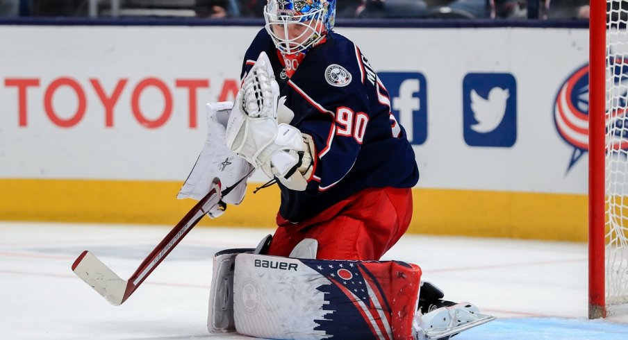 Elvis Merzlikins makes a save against the Ottawa Senators