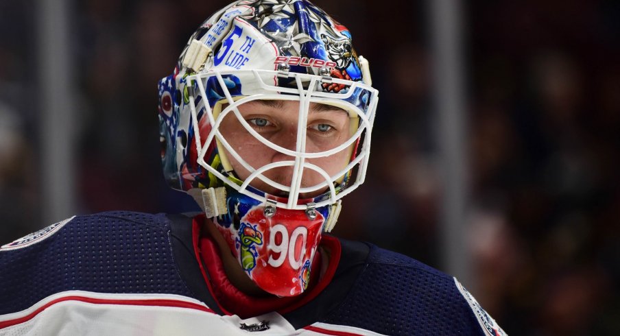 Mar 8, 2020; Vancouver, British Columbia, CAN; Columbus Blue Jackets goaltender Elvis Merzlikins (90) awaits the start of play against the Vancouver Canucks during the first period at Rogers Arena.