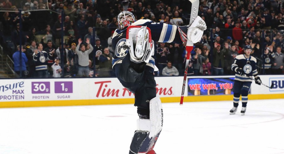 Jan 14, 2020; Columbus, Ohio, USA; Columbus Blue Jackets goalie Elvis Merzlikins (90) celebrates the win after the game with the Boston Bruins at Nationwide Arena.